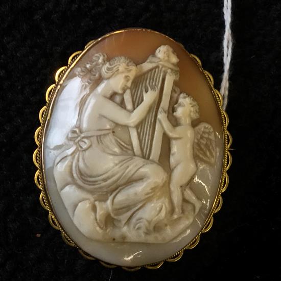 Cameo brooch carved with harpist & cherub, 9ct gold mount